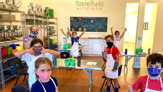 Kids cooking in Taste Buds Kitchen
