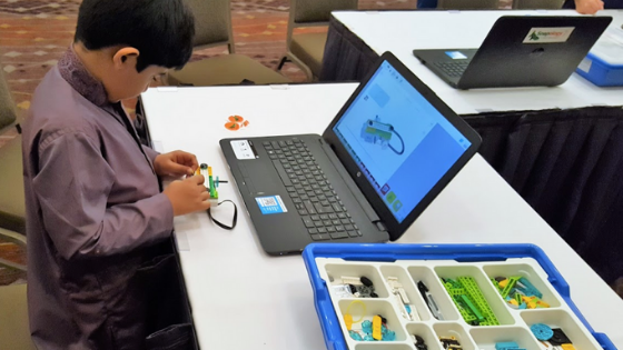 Child in Robotics Class
