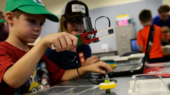 Child in LEGO inspired camp