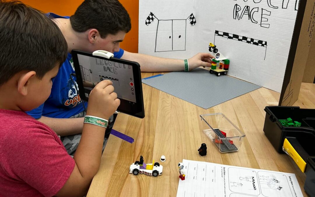 boy working on a programming project at snapology