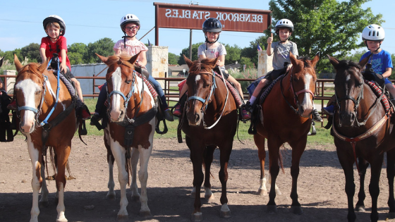 Kids riding horses