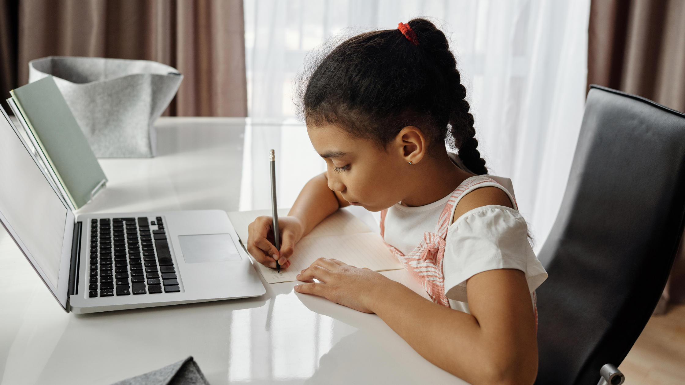 girl working in front of a laptop