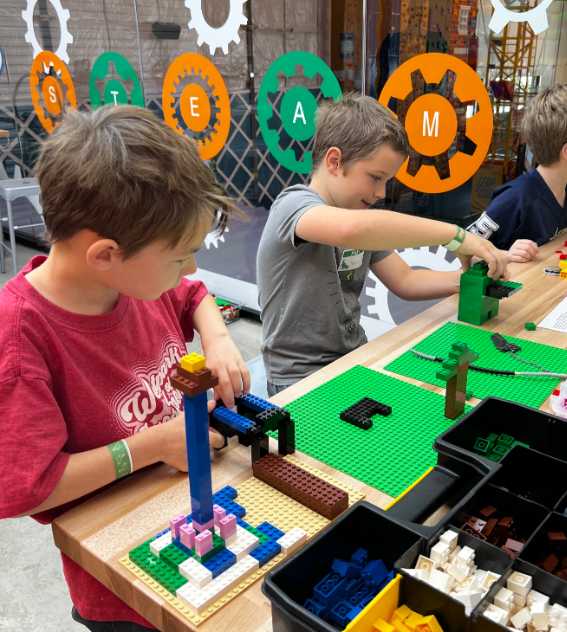 boys building using LEGO® bricks