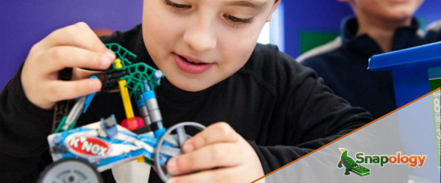 boy creating a snapology bicycle