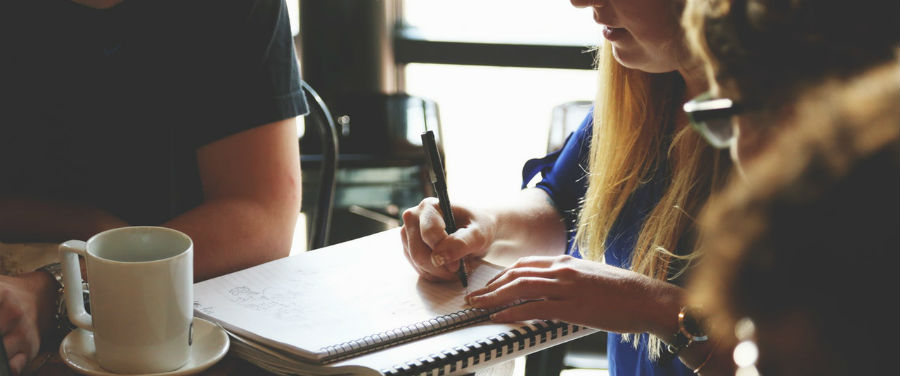 woman writing in a notebook