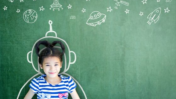 young girl in chalk astronaut outline