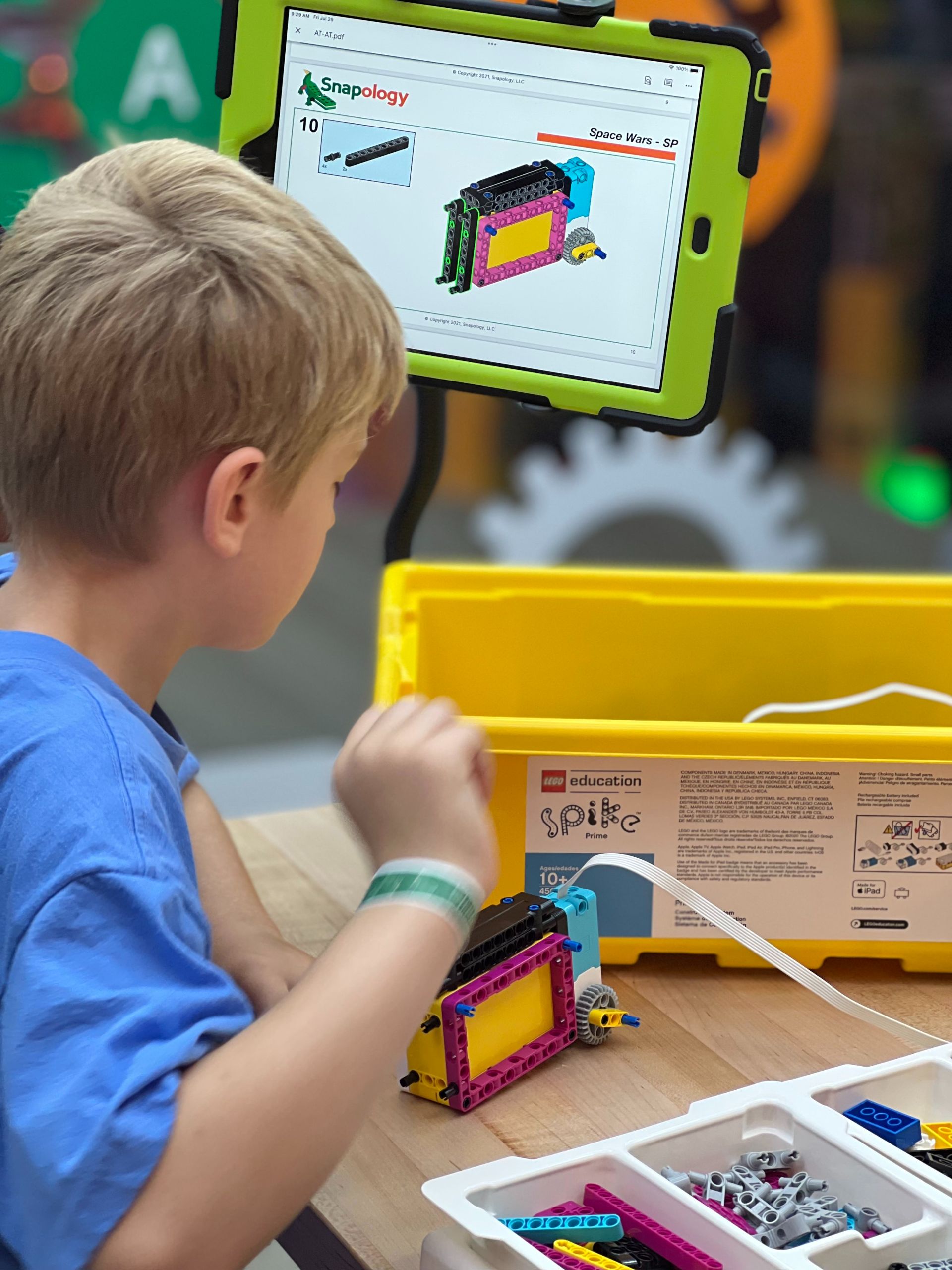 boy shows off lego camp project