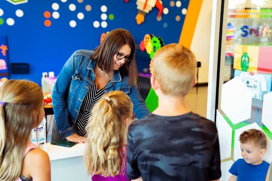 A STEAM class with a facilitator and kids